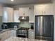 Open concept kitchen with granite countertops and stainless steel appliances at 5834 Cremona Dr., Myrtle Beach, SC 29577