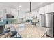 Bright kitchen with white cabinets, stainless appliances, and large granite island at 5834 Cremona Dr., Myrtle Beach, SC 29577