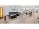 Bright and open living space with modern furniture, a stylish kitchen, and hardwood flooring at 5834 Cremona Dr., Myrtle Beach, SC 29577