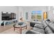 Bright living room with modern furnishings, including a plush sofa and a flat screen tv at 5834 Cremona Dr., Myrtle Beach, SC 29577