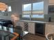 Wet bar with granite countertops, white cabinets, a wine rack, and a beverage cooler at 5834 Cremona Dr., Myrtle Beach, SC 29577