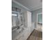 Bathroom featuring a single vanity, quartz countertops, and shower/bath at 605 15Th Ave. S, North Myrtle Beach, SC 29582