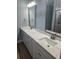 Primary bathroom with dual sinks, quartz countertop, and modern mirrors at 605 15Th Ave. S, North Myrtle Beach, SC 29582
