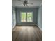 Cozy bedroom features a ceiling fan, wood-look floors, and natural light at 605 15Th Ave. S, North Myrtle Beach, SC 29582