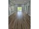 Spacious living room with access to balcony and open to the kitchen area at 605 15Th Ave. S, North Myrtle Beach, SC 29582