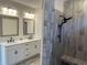 Bright bathroom with a double vanity and a tiled walk-in shower at 870 Monterrosa Dr., Myrtle Beach, SC 29572