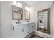 Bright bathroom featuring a double vanity with modern fixtures and large decorative mirrors at 870 Monterrosa Dr., Myrtle Beach, SC 29572