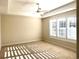 Bedroom with ample natural light, neutral carpeting, and a ceiling fan at 870 Monterrosa Dr., Myrtle Beach, SC 29572