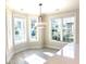 Bright dining area with large windows and modern light fixture at 870 Monterrosa Dr., Myrtle Beach, SC 29572