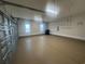 Spacious garage with epoxy flooring, window for natural light, and storage shelves along the back wall at 870 Monterrosa Dr., Myrtle Beach, SC 29572