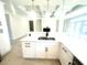 Modern kitchen featuring white cabinets, quartz countertops, stainless steel sink with matte black faucet and neutral color scheme at 870 Monterrosa Dr., Myrtle Beach, SC 29572