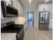 Galley kitchen with stainless appliances, white cabinetry, and stone countertops at 870 Monterrosa Dr., Myrtle Beach, SC 29572