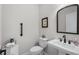 Cozy powder room with marble countertop, pedestal sink, framed mirror and toilet at 870 Monterrosa Dr., Myrtle Beach, SC 29572