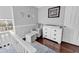Comfortable Bedroom features neutral colors, a chair with an ottoman, and a changing table dresser at 2629 Scarecrow Way, Myrtle Beach, SC 29579