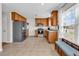 Charming kitchen featuring stainless steel appliances, tile floors and view to backyard at 2629 Scarecrow Way, Myrtle Beach, SC 29579
