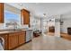 Charming kitchen with tile floors, stainless dishwasher and view into dining area at 2629 Scarecrow Way, Myrtle Beach, SC 29579