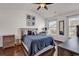 Primary bedroom featuring hardwood floors, fan and lots of natural light at 2629 Scarecrow Way, Myrtle Beach, SC 29579