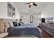 Primary bedroom featuring hardwood floors, fan and lots of natural light at 2629 Scarecrow Way, Myrtle Beach, SC 29579