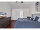 Primary bedroom featuring hardwood floors, fan and lots of natural light at 2629 Scarecrow Way, Myrtle Beach, SC 29579