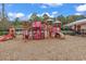Colorful community playground equipment set in mulch with mature trees nearby at 2629 Scarecrow Way, Myrtle Beach, SC 29579