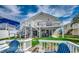 The backyard features white fencing, green grass, and a patio beneath the deck at 325 52Nd Ave. N, North Myrtle Beach, SC 29582