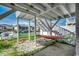 Waterfront backyard features a hammock for relaxing and stairs leading up to a deck at 325 52Nd Ave. N, North Myrtle Beach, SC 29582
