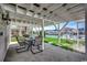 Covered patio with outdoor seating overlooking the canal and lush landscaping, perfect for relaxing at 325 52Nd Ave. N, North Myrtle Beach, SC 29582