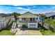 Exterior of a two-story home with front porch, palm trees, and a garage at 325 52Nd Ave. N, North Myrtle Beach, SC 29582