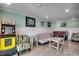 Spacious game room with Pac-Personal machine, foosball table, and comfortable seating at 325 52Nd Ave. N, North Myrtle Beach, SC 29582