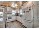Bright kitchen with white cabinets, granite countertops, stainless steel appliances and wood ceiling at 325 52Nd Ave. N, North Myrtle Beach, SC 29582
