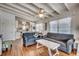Cozy living room with hardwood floors, ceiling fan, and view of the kitchen at 325 52Nd Ave. N, North Myrtle Beach, SC 29582