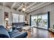 Cozy living room with hardwood floors, ceiling fan, and sliding doors to the deck at 325 52Nd Ave. N, North Myrtle Beach, SC 29582
