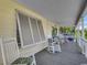 Covered porch with rocking chairs with a partial water view at 325 52Nd Ave. N, North Myrtle Beach, SC 29582