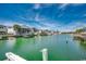 Scenic waterfront view of a waterway lined with houses, docks, and palm trees at 325 52Nd Ave. N, North Myrtle Beach, SC 29582