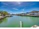 Beautiful waterfront view with houses, docks, and palm trees along the waterway at 325 52Nd Ave. N, North Myrtle Beach, SC 29582
