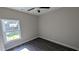 Bedroom featuring a ceiling fan, luxury vinyl flooring and double hung window at 3566 Steamer Trace Rd., Conway, SC 29527