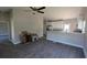 Open-concept living room leading into kitchen, with white cabinets, hardwood floors, and stainless appliances at 3566 Steamer Trace Rd., Conway, SC 29527