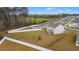 Aerial view showcasing a large backyard with fencing, pool, and playset at 380 Harvest Ridge Way, Conway, SC 29527