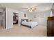 Spacious primary bedroom with a walk-in closet, soft carpet, and a ceiling fan at 380 Harvest Ridge Way, Conway, SC 29527