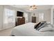 Comfortable primary bedroom featuring large windows, ceiling fan, and furniture at 380 Harvest Ridge Way, Conway, SC 29527