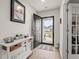 Inviting entryway with tiled floors, decorative console table, and front door view to the outdoors at 380 Harvest Ridge Way, Conway, SC 29527