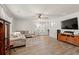 Cozy living room featuring a comfortable sectional, modern decor, and a mounted TV at 380 Harvest Ridge Way, Conway, SC 29527