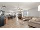 Spacious living room open to the kitchen, featuring modern flooring and a cozy seating area at 380 Harvest Ridge Way, Conway, SC 29527