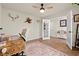 Office space with natural light, wooden desk, and decorative accents and a ceiling fan at 380 Harvest Ridge Way, Conway, SC 29527