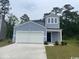 Charming single-Gathering home with a two-car garage and a well-maintained lawn at 382 Ladyfish Loop, Sunset Beach, NC 28468