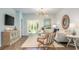 Inviting living space featuring modern decor, a jute rug, and a stylish entertainment cabinet at 382 Ladyfish Loop, Sunset Beach, NC 28468