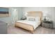 Serene main bedroom with a cushioned headboard and neutral decor, with an ensuite at 382 Ladyfish Loop, Sunset Beach, NC 28468