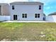 Exterior view of backyard, showing the siding of the house, the fence, and a grassy area at 5088 Wavering Place Loop, Myrtle Beach, SC 29579