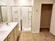 Bright bathroom with tiled floors, a double vanity and glass-enclosed shower at 5088 Wavering Place Loop, Myrtle Beach, SC 29579