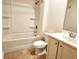Clean bathroom with a bathtub, a toilet, and a single sink vanity at 5088 Wavering Place Loop, Myrtle Beach, SC 29579
